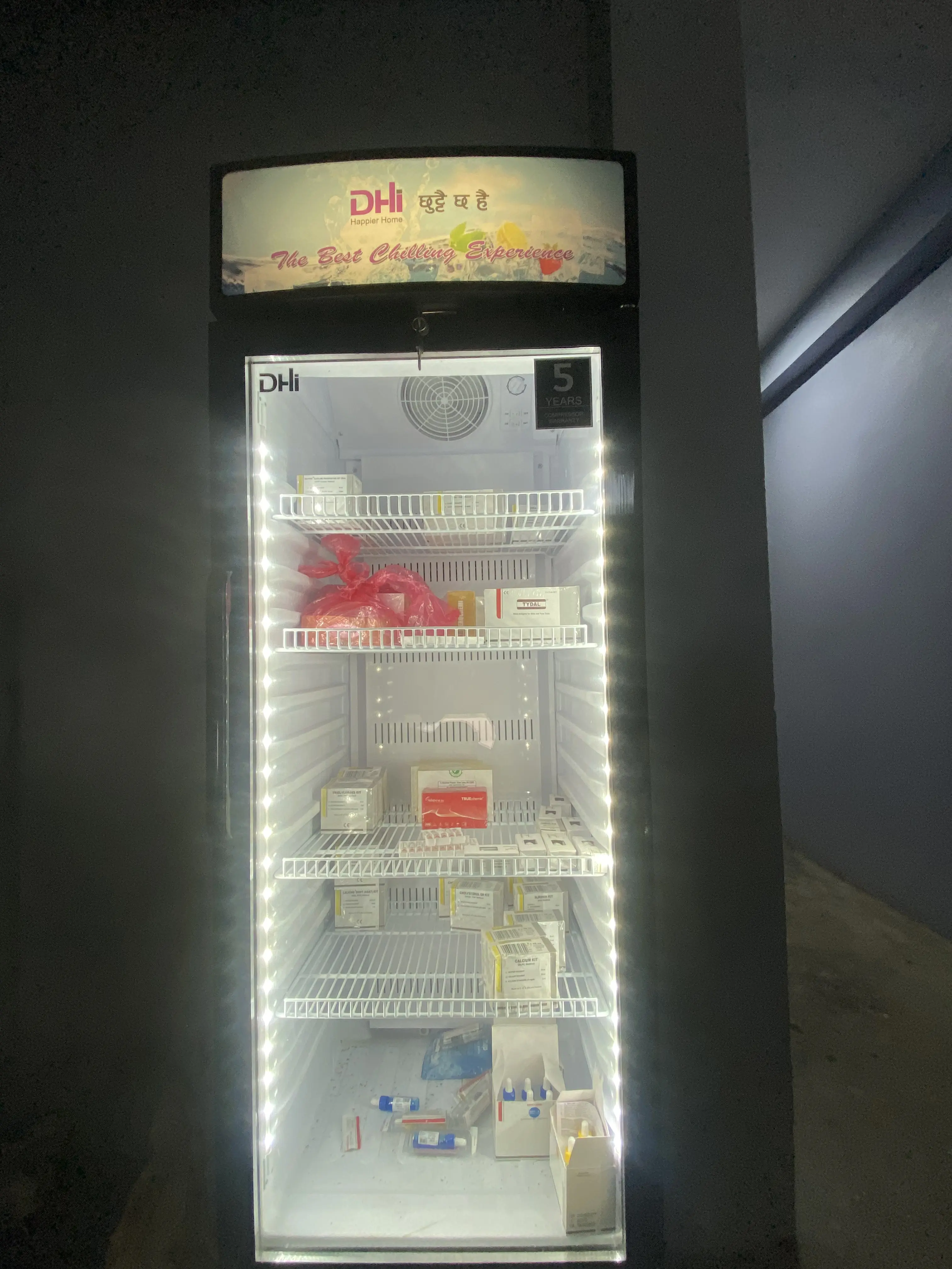 Shelves organised with boxes and packages of medical supplies